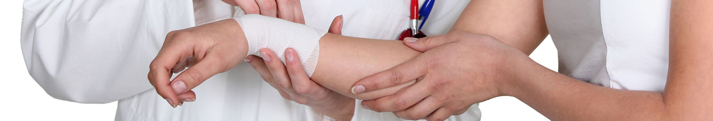 doctor bandaging hand injury